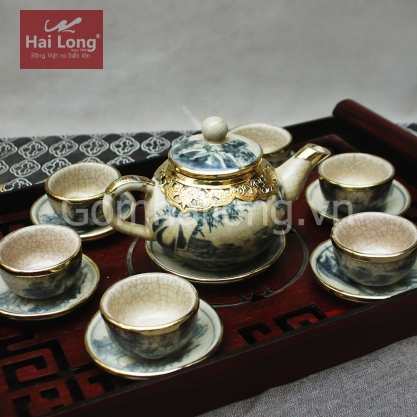 Bộ ấm trà dáng quả hồng bọc đồng (Men rạn)